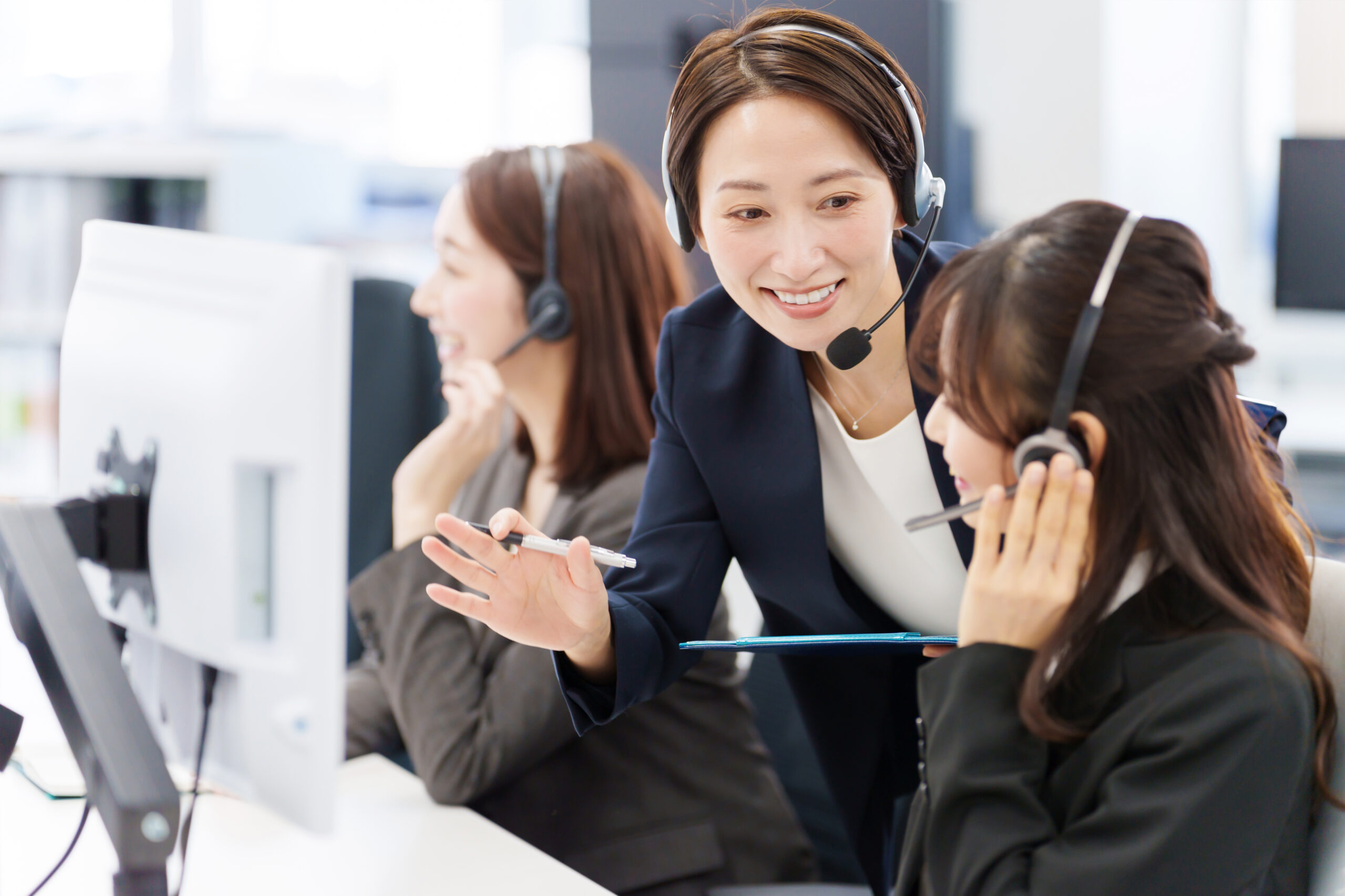 a group of women wearing headsets