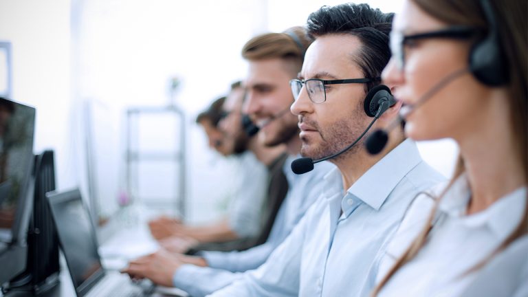Cxperts Business Process Outsourcing (BPO) professionals working seriously in a modern office environment , collaborating on customer experience solutions