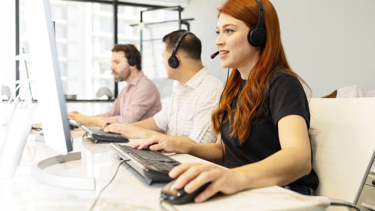 Cxperts Business Process Outsourcing (BPO) professionals working in a modern office environment, collaborating on customer experience solutions